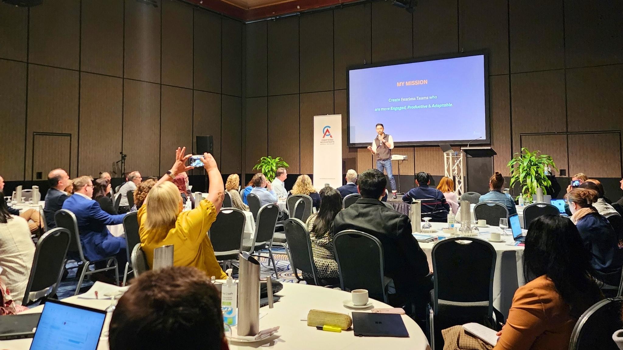 Jeremy Khoh delivering a leadership keynote to a corporate audience